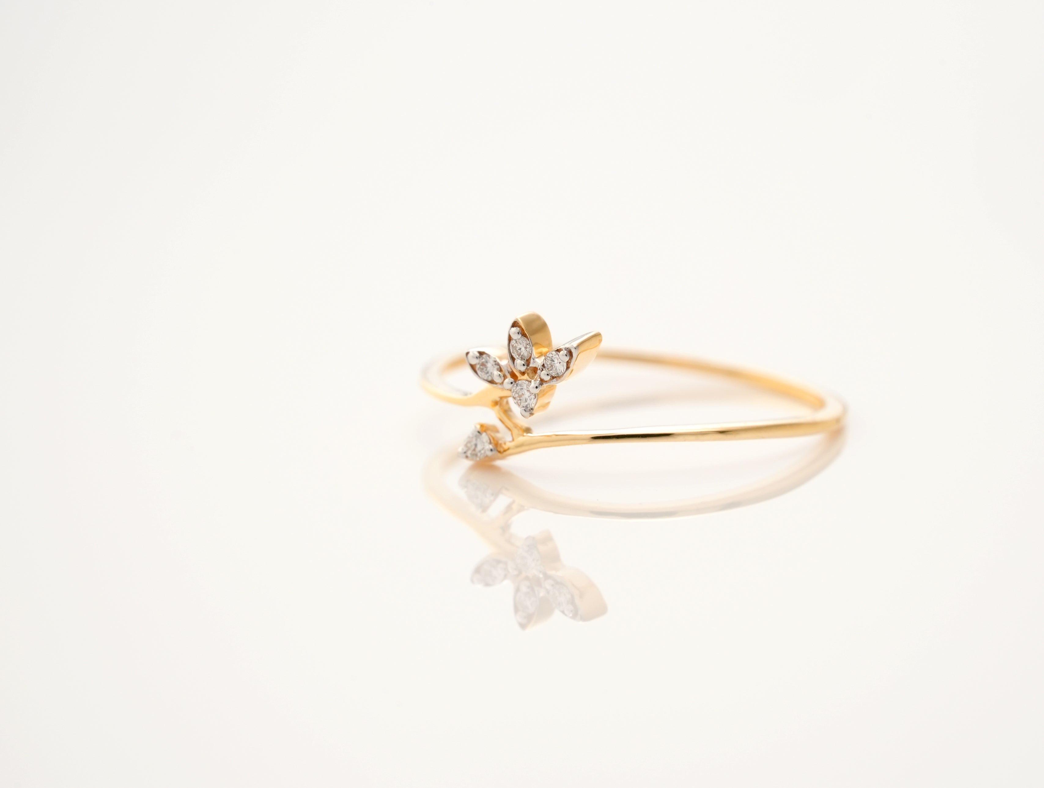 Minimalist Yellow Gold Band Ring with Diamond Floral Accent