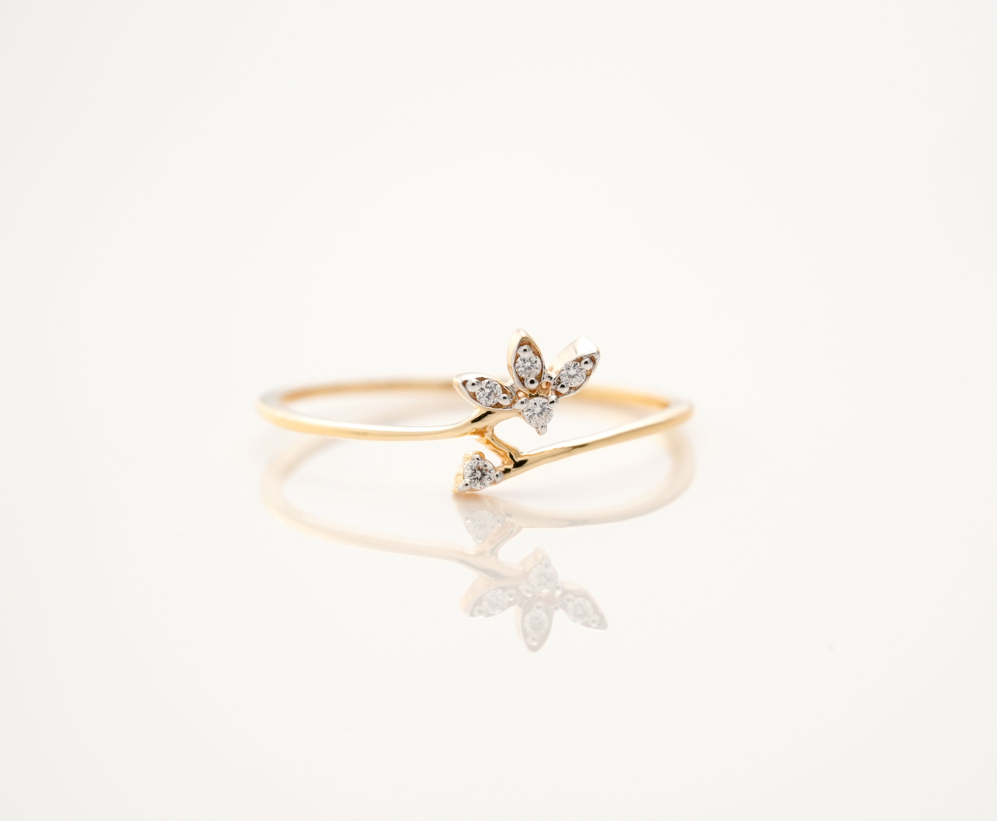 Minimalist Yellow Gold Band Ring with Diamond Floral Accent